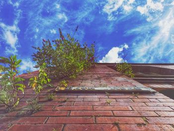 Low angle view of building against cloudy sky