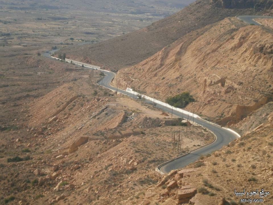 landscape, transportation, mountain, field, tranquility, tranquil scene, nature, high angle view, scenics, rural scene, day, road, non-urban scene, no people, outdoors, sky, beauty in nature, remote, sunlight, desert