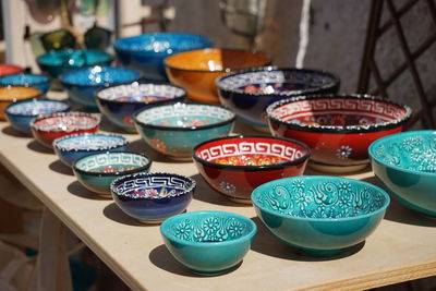 High angle view of colorful bowls for sale at market