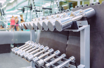 Close-up of dumbbells in gym