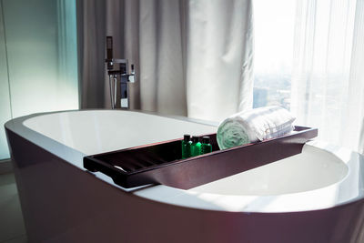 Close-up of electric lamp on table at home