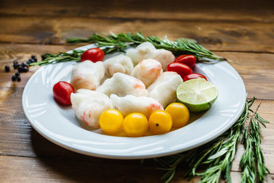 Close-up of fruits in plate on table