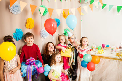 High angle view of two people with balloons