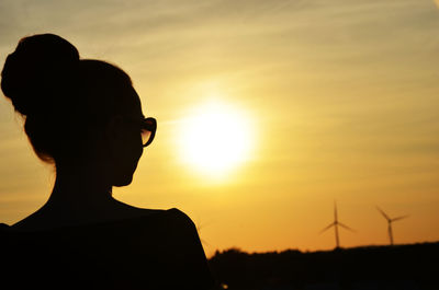 Silhouette of people at sunset