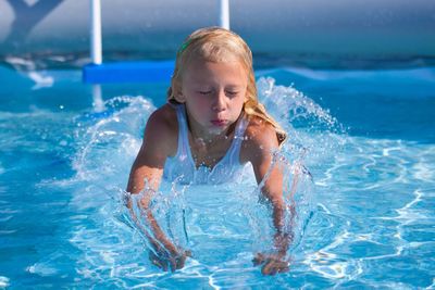 Boy playing in swimming pool