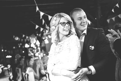 Tilt shot of newlywed young couple during wedding reception