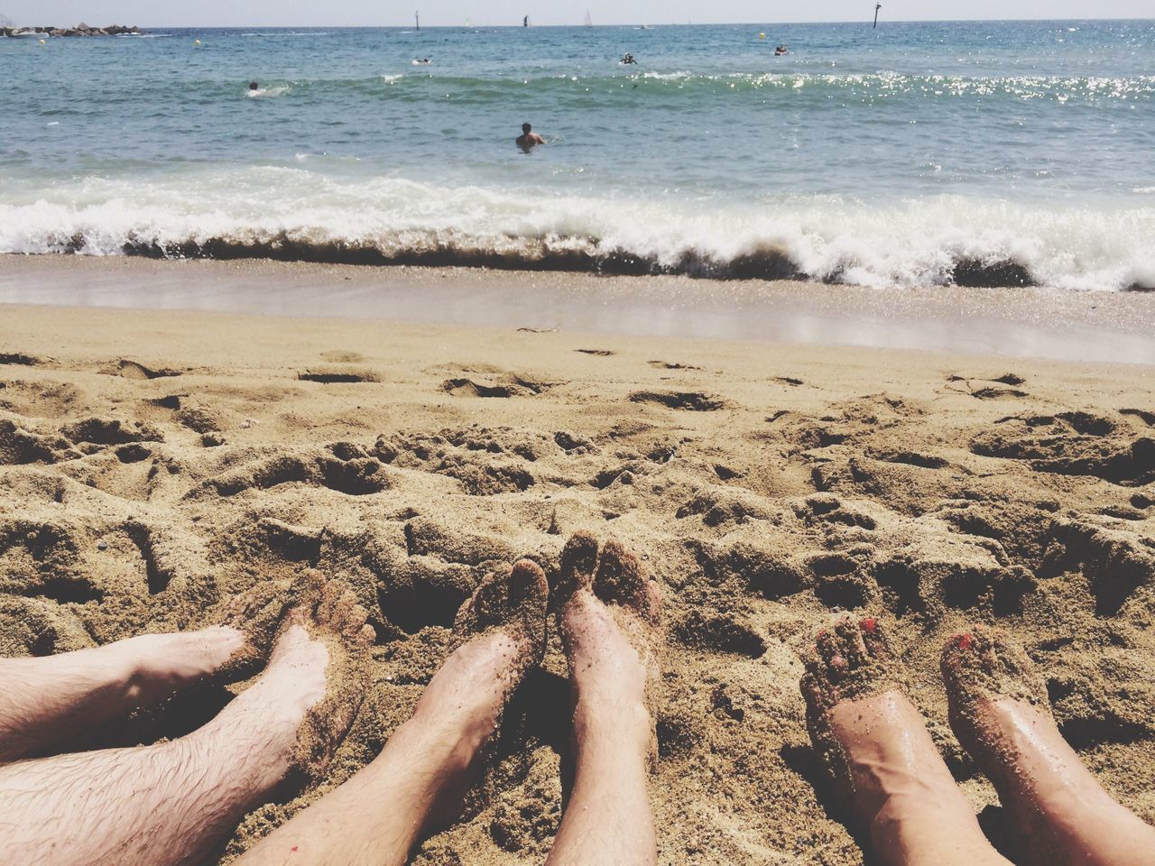 beach, sea, water, sand, shore, horizon over water, vacations, leisure activity, lifestyles, relaxation, barefoot, person, summer, low section, sunlight, tourism