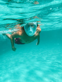 Man swimming in pool