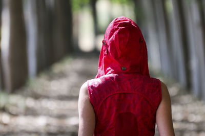 Rear view of woman wearing red hood