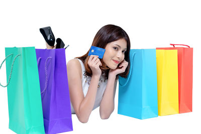 Portrait of woman against blue background