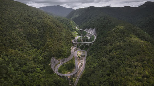 Scenic view of mountain road amidst trees