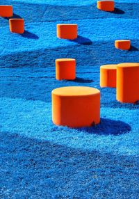 Close-up of multi colored umbrellas on sand