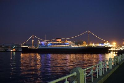 Boats in harbor at night