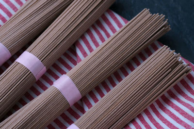 High angle view of raw soba noodles on napkin