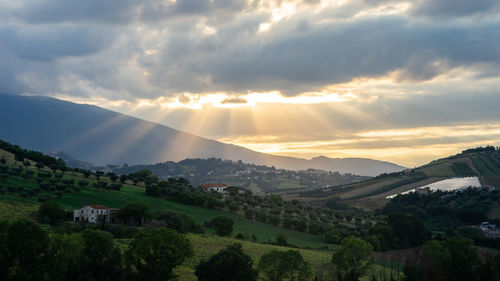 Scenic view of mountains against sky during sunset