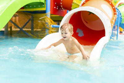 Boy swimming in pool