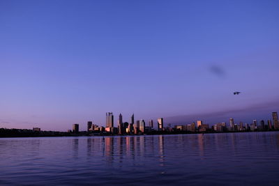 Scenic view of buildings against sky during sunset