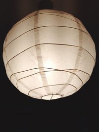 Low angle view of illuminated lights at night