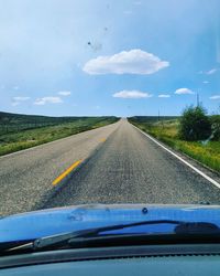 Road seen through car windshield