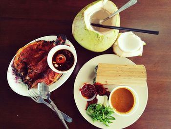 Directly above view of breakfast served on table