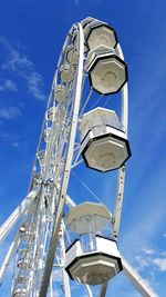 Low angle view of ferris wheel against sky