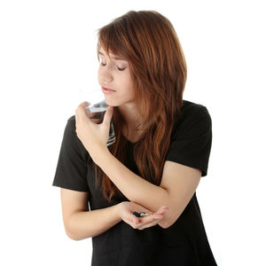 Beautiful woman standing against white background