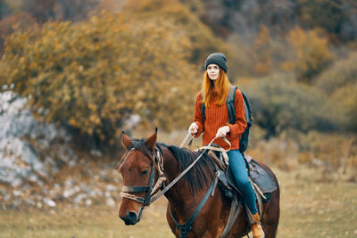 Portrait of a man riding horse