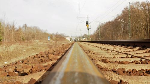 Surface level of railroad track against sky