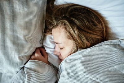 Woman sleeping in bed