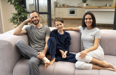 Young couple sitting on sofa