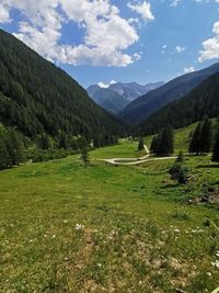 Scenic view of landscape and mountains against sky