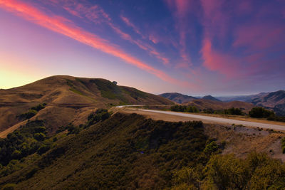 Scenic view of mountains against sky during sunset