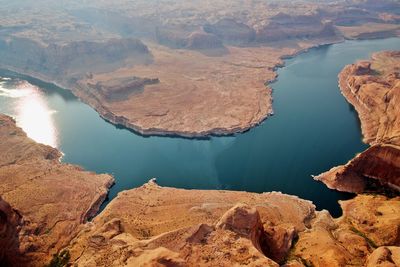 High angle view of rock formations by lake