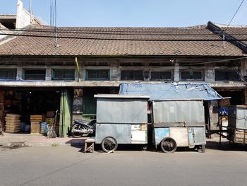 Vintage car on street against buildings