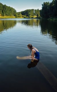 Reflection of man in lake