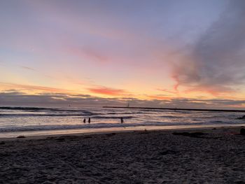 Scenic view of beach against sky during sunset