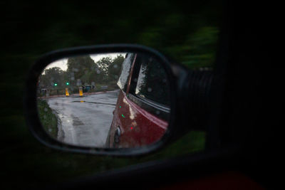 Reflection of car on side-view mirror