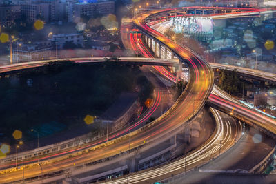 High angle view of light trails on road in city