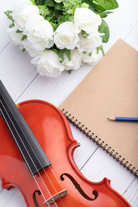 High angle view of white roses on table