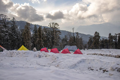 A campsite covered with snow on a himalayan mountain