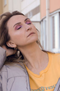 Close-up of woman with eyes closed