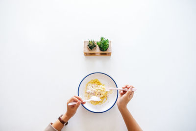 Directly above shot of man holding bowl