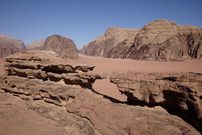 Rocks in desert against sky