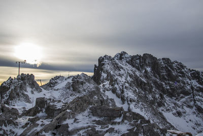 Scenic view of snow mountains against sky