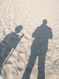 Shadow of man on sand