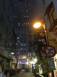 Illuminated city street at night