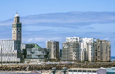 Modern buildings in city against sky