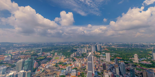 High angle view of city buildings against sky