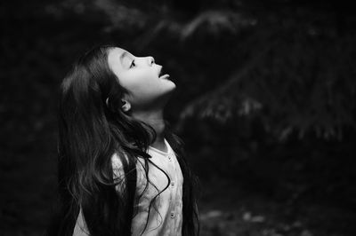 Girl looking away in forest