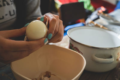 Close-up of person preparing food on table